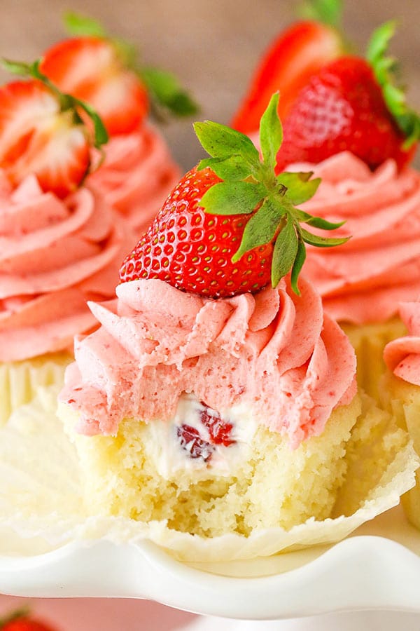 Strawberries and Cream Cupcakes - moist vanilla cupcakes, fresh cream with chopped strawberries and strawberry frosting!