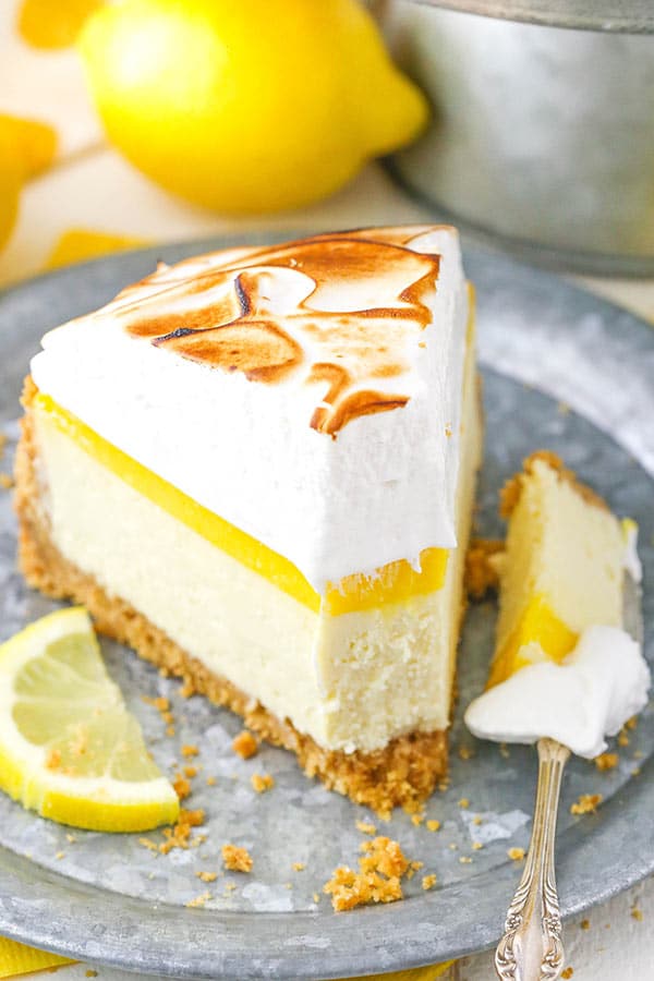 Lemon Meringue Cheesecake bite taken out of slice