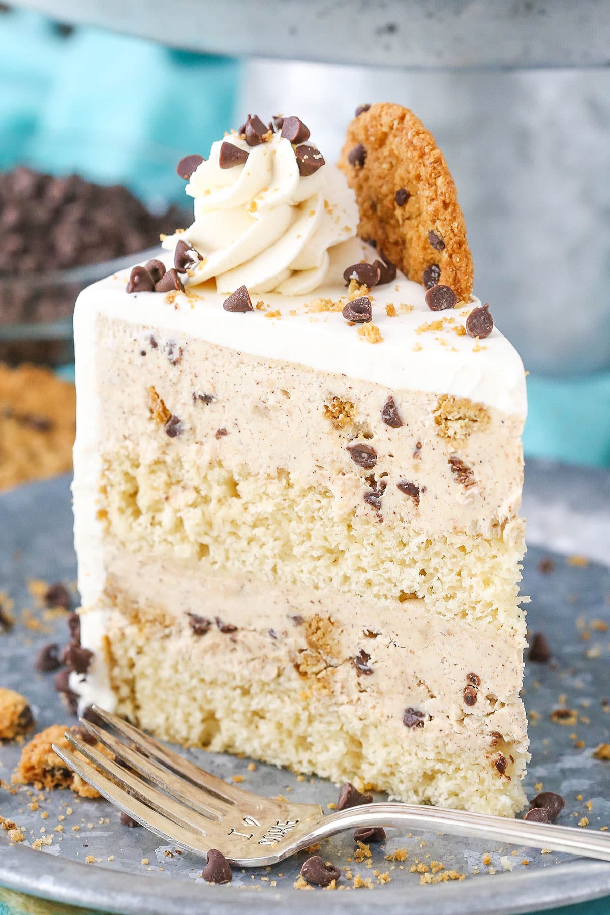 This oatmeal chocolate chip cookie ice cream cake is full of chocolate chips, crunchy oatmeal cookies, and ice cream! It's perfect for summer! Slice of oatmeal cookie ice cream cake.