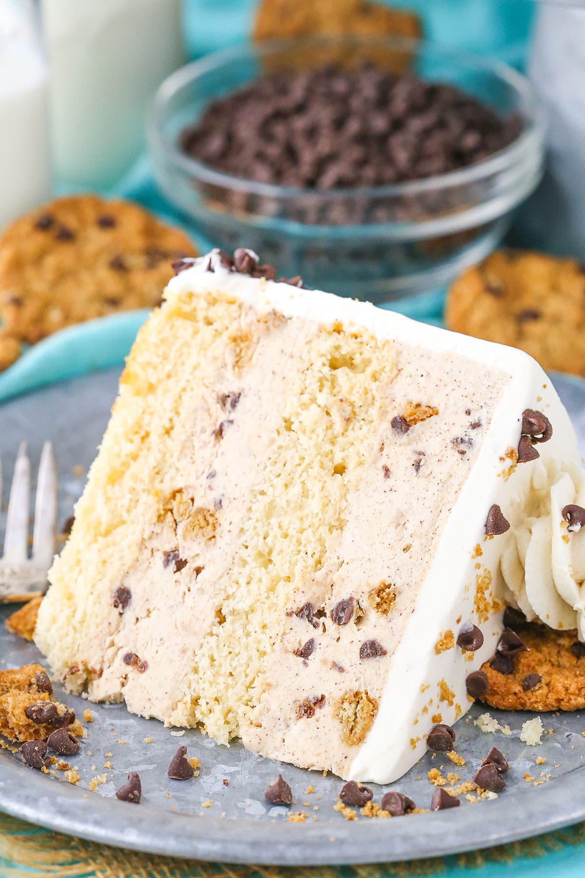 Slice of chocolate chip oatmeal cookie ice cream cake on a plate.