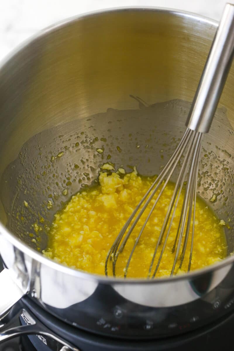 all the ingredients combined in metal bowl over simmering pot of water.