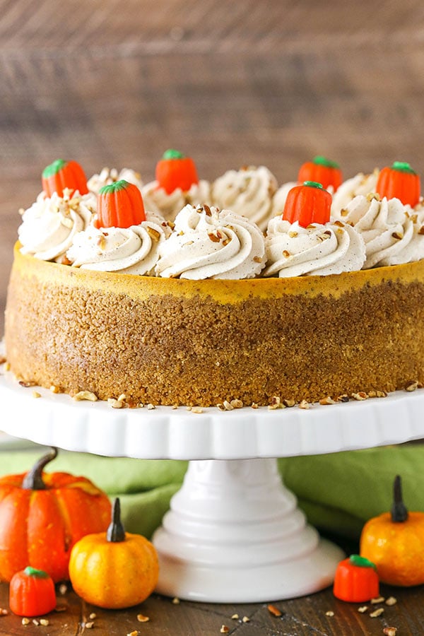 Side view of Pumpkin Cheesecake on white stand
