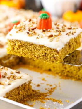 Slice of pumpkin sheet cake on a spatula.