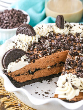 Sliced chocolate cream pie in a white baking dish.