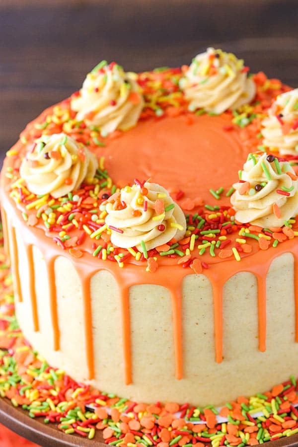 Decorated spice cake with pumpkin mascarpone buttercream.