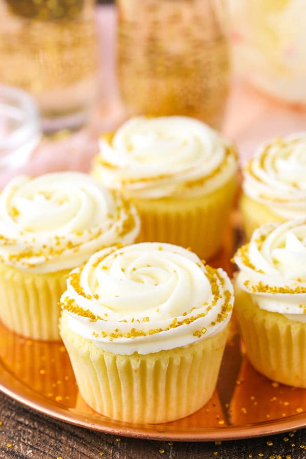 Moist Champagne Cupcakes with champagne truffle filling and champagne buttercream!