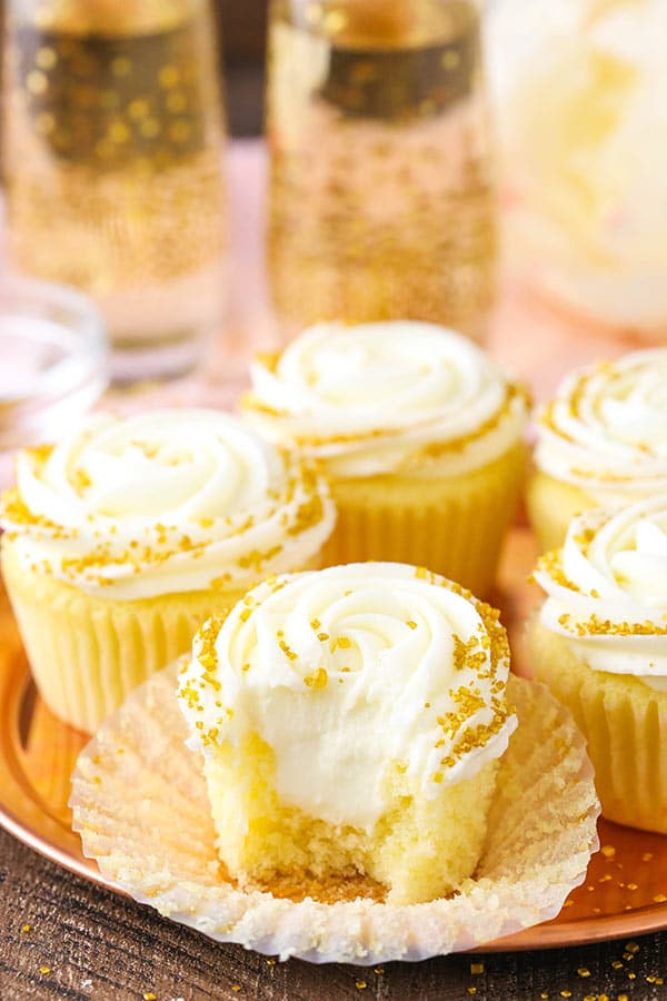 Moist Champagne Cupcakes with champagne truffle filling and champagne buttercream!