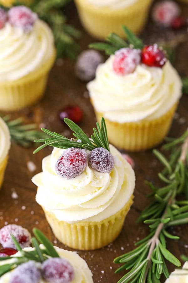 Sparkling Cranberry White Chocolate Cupcakes! A moist vanilla cupcake with cranberry mascarpone filling and a white chocolate buttercream! Perfect dessert for Christmas!