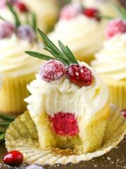 Sparkling Cranberry White Chocolate Cupcakes! A moist vanilla cupcake with cranberry mascarpone filling and a white chocolate buttercream! Perfect dessert for Christmas!