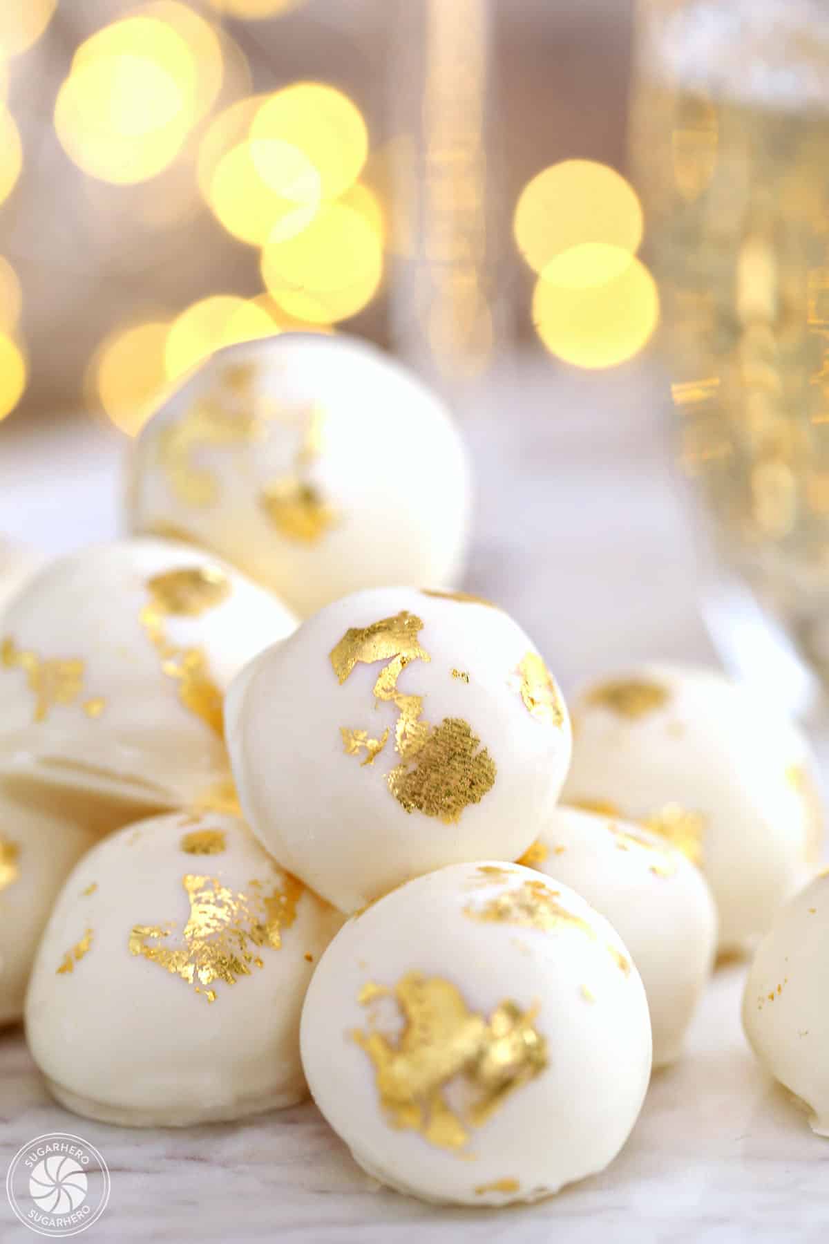 A pile of champagne white chocolate truffles. 