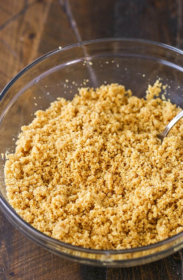 This graham cracker crust is easy to make and delicious, made with scratch from only four ingredients! It won't fall apart and it's perfect for baked pies, no bake pies and cheesecakes!