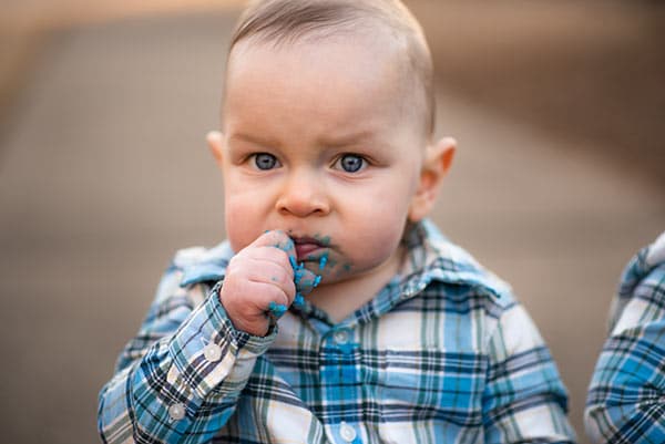 Ashton eating blue frosting