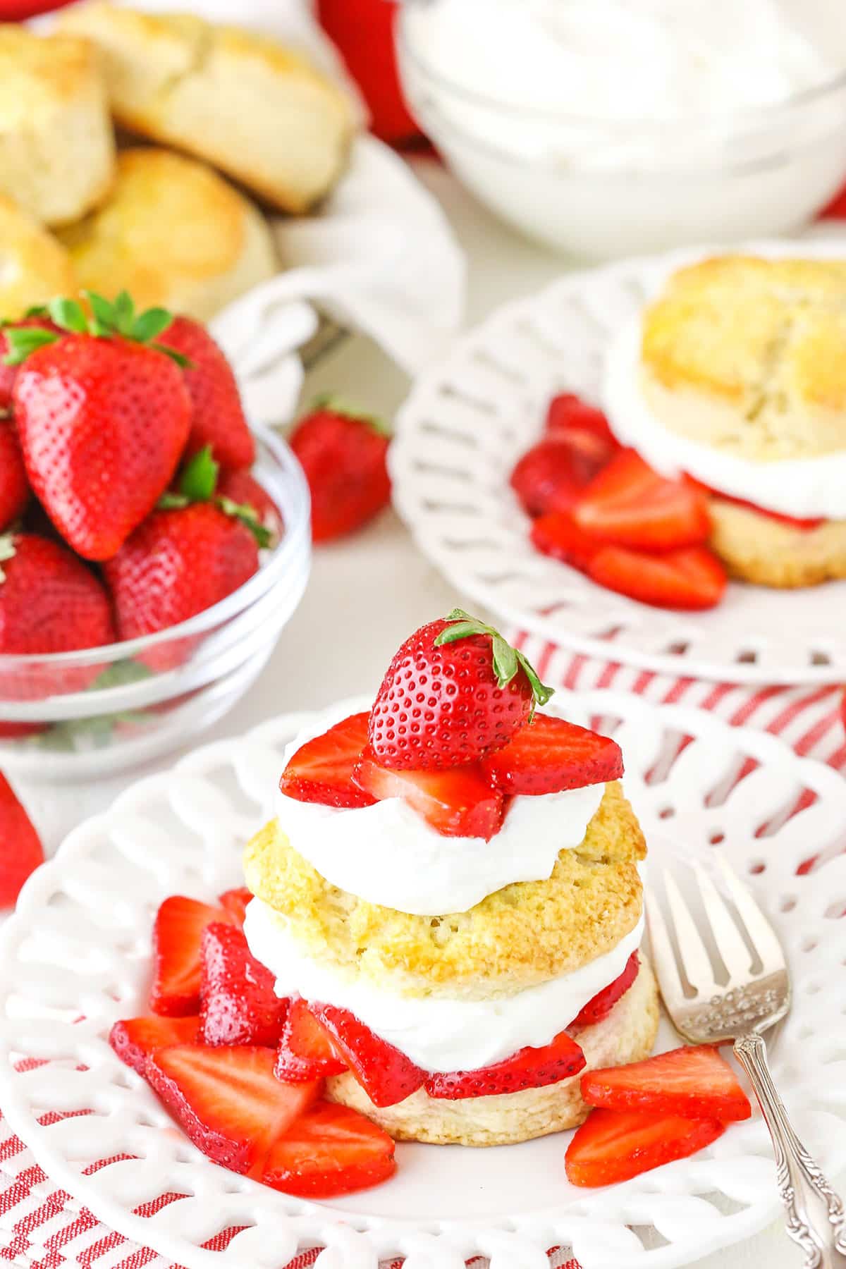 Strawberry shortcake with fresh sliced strawberries on top.