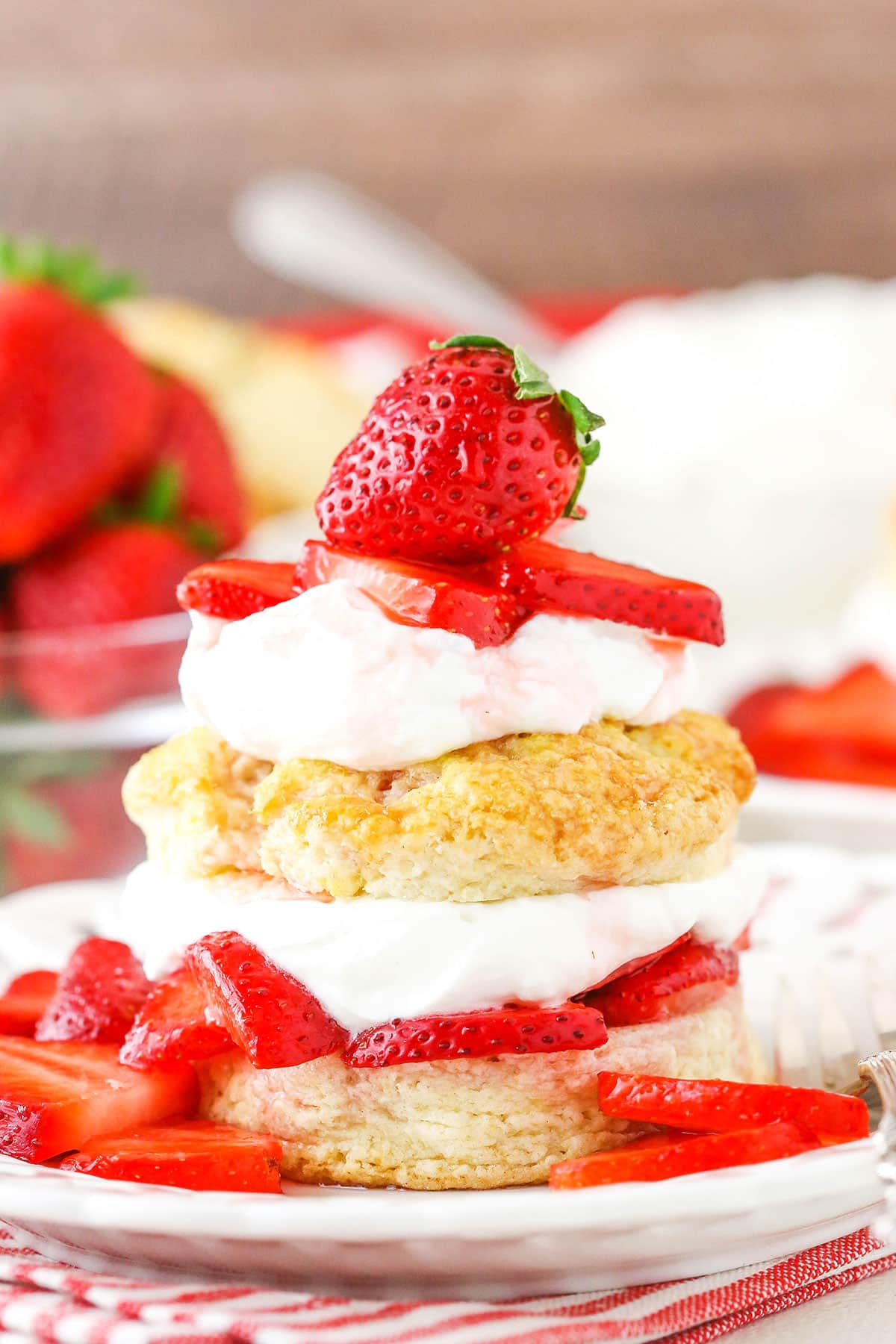 Classic strawberry shortcake with sliced strawberries on top.
