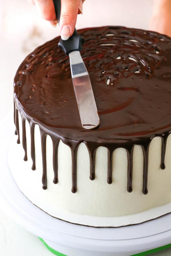 spreading the chocolate ganache with an offset spatula