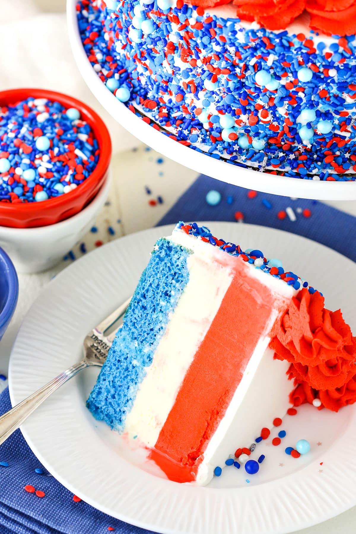 Ice cream cake with white and red frosting.