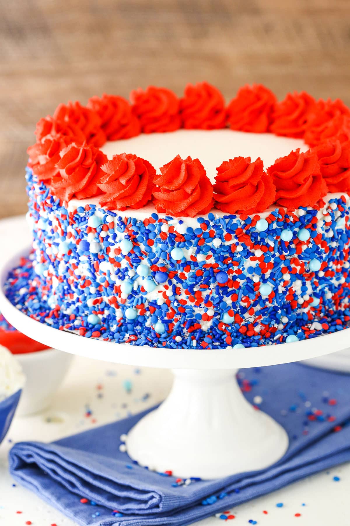 Red white and blue ice cream cake on a cake platter.