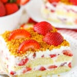Slice of strawberry cake with berry cream filling.