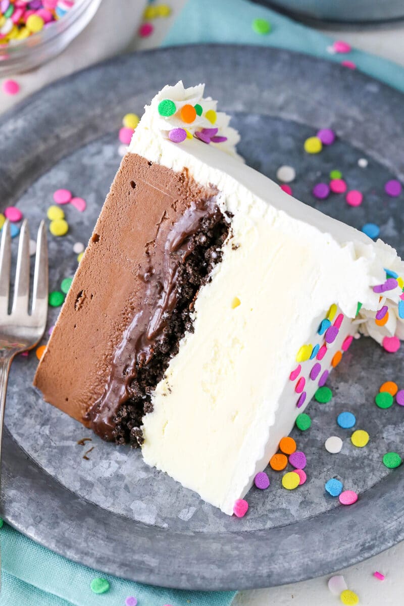 This Copycat Dairy Queen Ice Cream Cake layers chocolate and vanilla ice cream with that classic fudge and crunchy cookie center. It so easy! Slice of homemade DQ ice cream cake