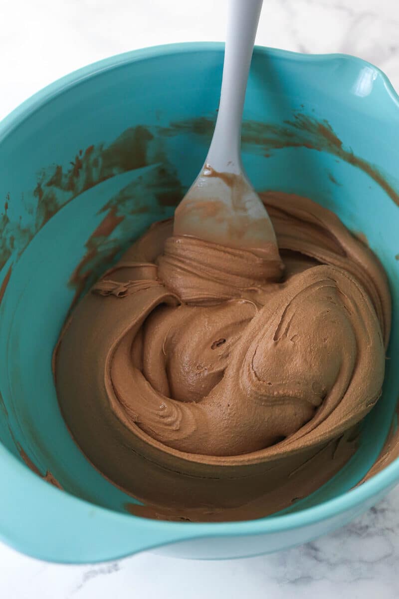 Softened chocolate ice cream in a blue bowl.
