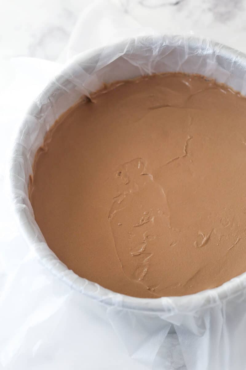 Softened chocolate ice cream in a pan.