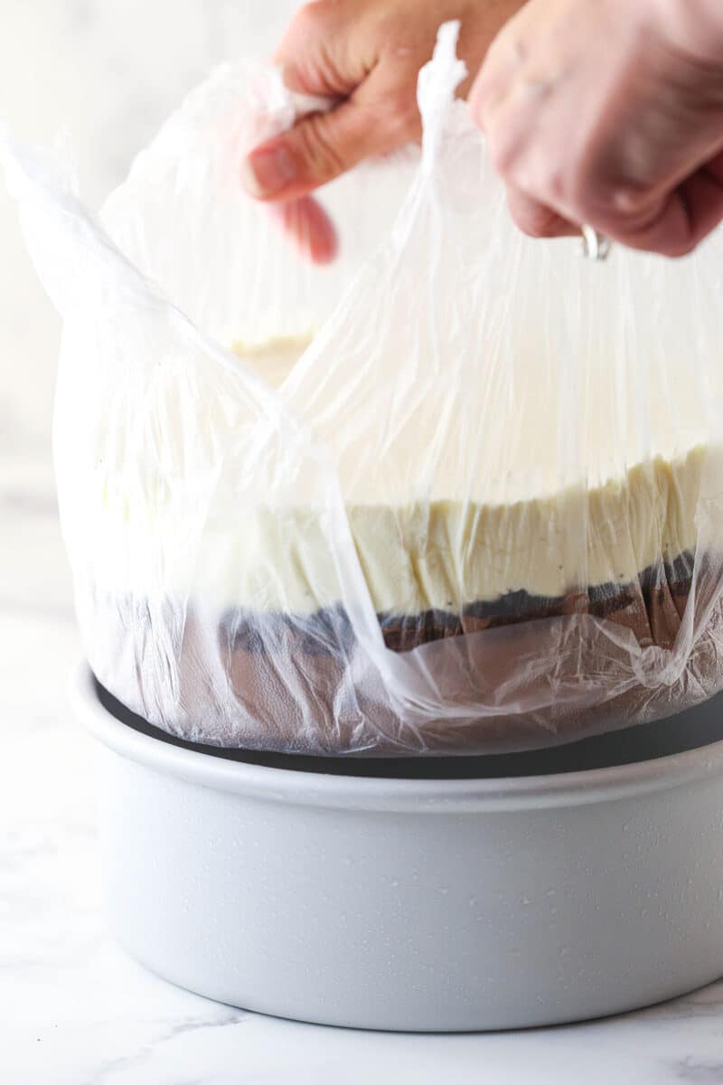 Lifting ice cream cake out of the pan.