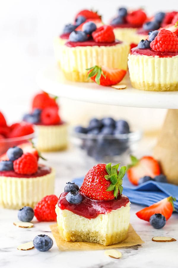 Mini Berry Almond Cheesecakes with bite taken