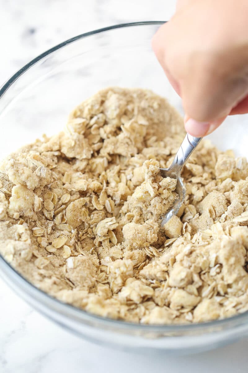 cutting the butter into streusel ingredients with a fork