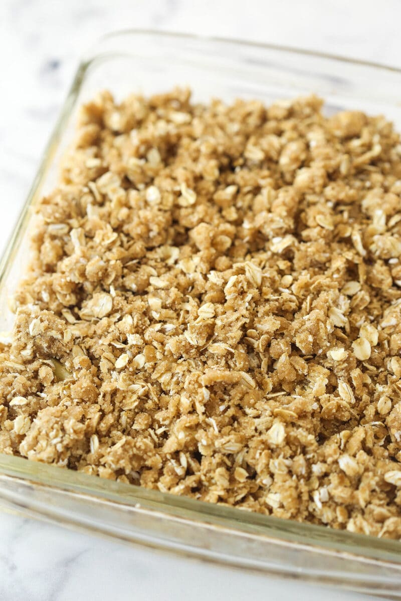 apples with streusel added in glass baking dish