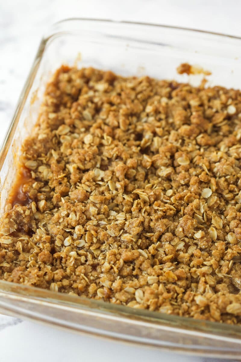 baked apple crisp in glass baking dish