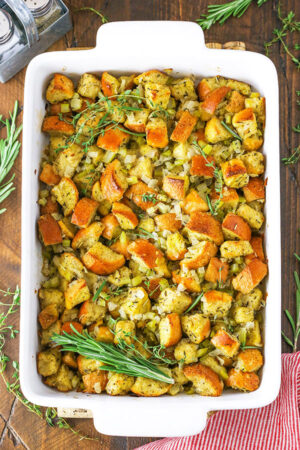A White Pan Filled with Thanksgiving Dressing on a Wooden Table