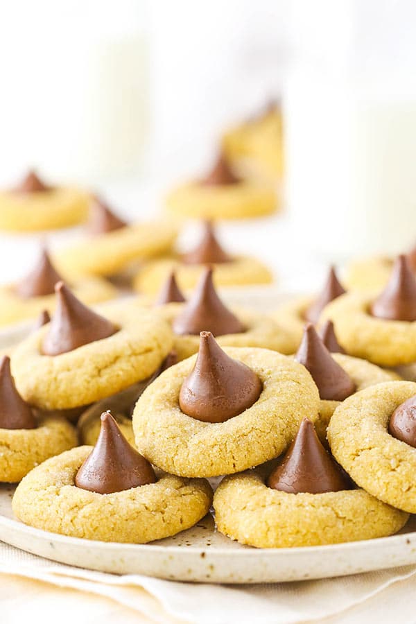 Homemade peanut butter cookies with a chocolate kiss on top of each one 