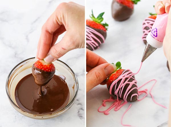 Dipping a strawberry in chocolate thend ecorating with pink chocolate