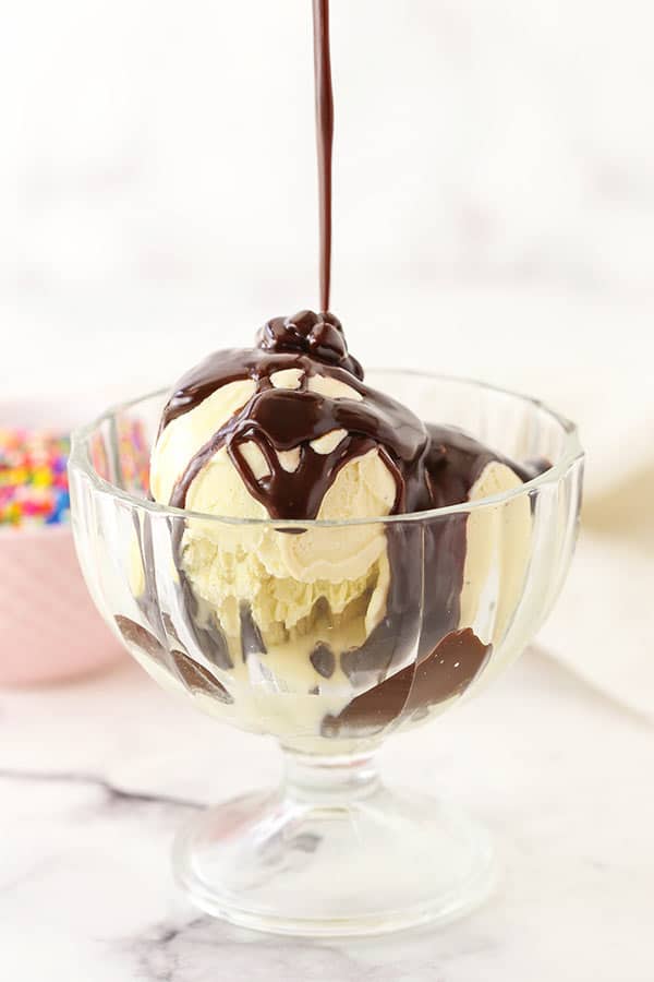 Easy Homemade Hot Fudge Sauce being poured over ice cream