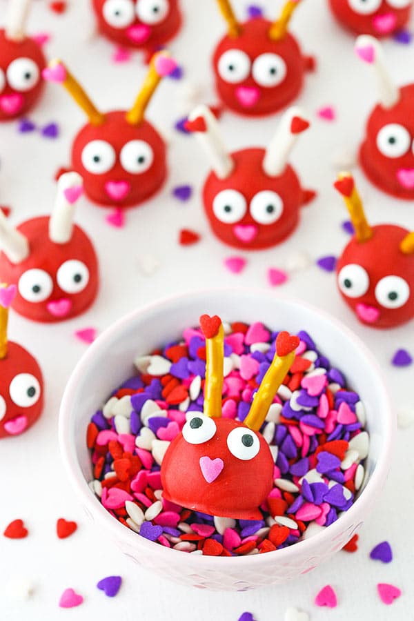 Love Bug Oreo Cookie Balls in cup of sprinkles