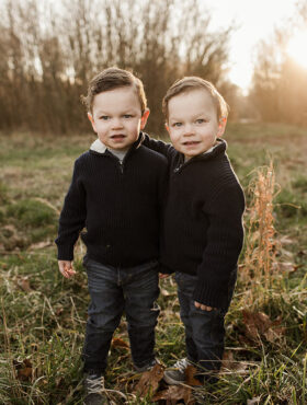 Twins standing together