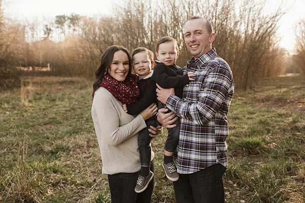 image of Lindsay and Ian standing holding twins