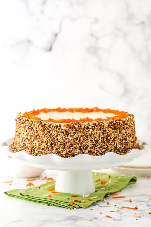 cheesecake swirl carrot cake on cake stand