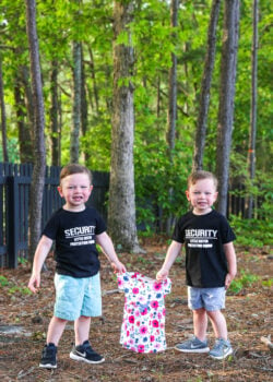 ashton and brooks holding a little girl dress