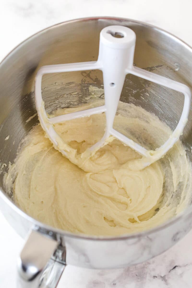 These zucchini brownies are not only quick and easy to make, they have the perfect super dense and fudgy texture. Overhead view of butter, sugar, oil and vanilla extract combined in a large mixing bowl