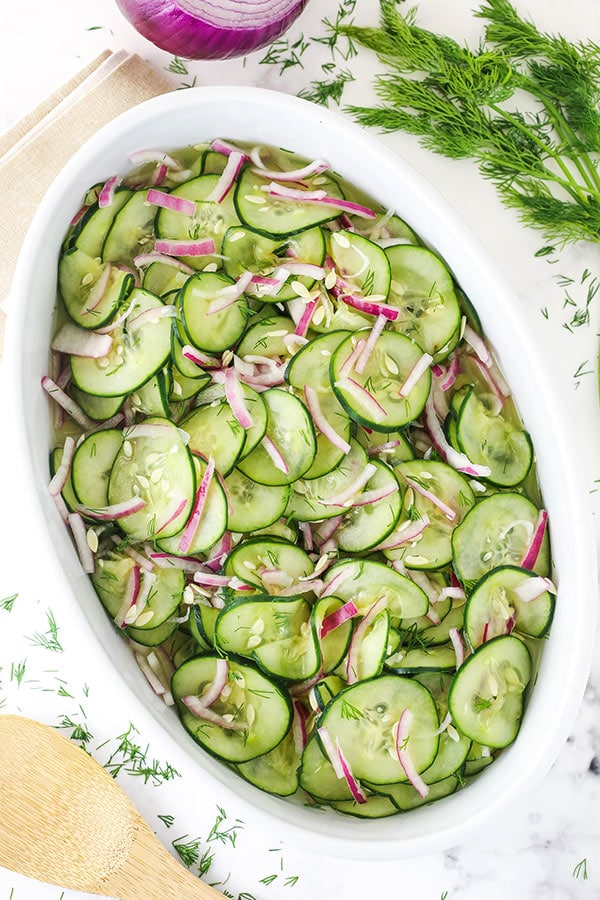overhead image of cucumber salad in white dish