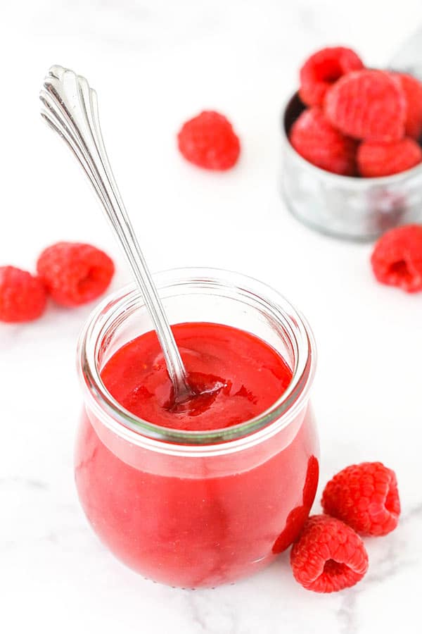 overhead image of raspberry sauce in a jar