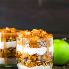 side close up of trifle with some sliced apples around it