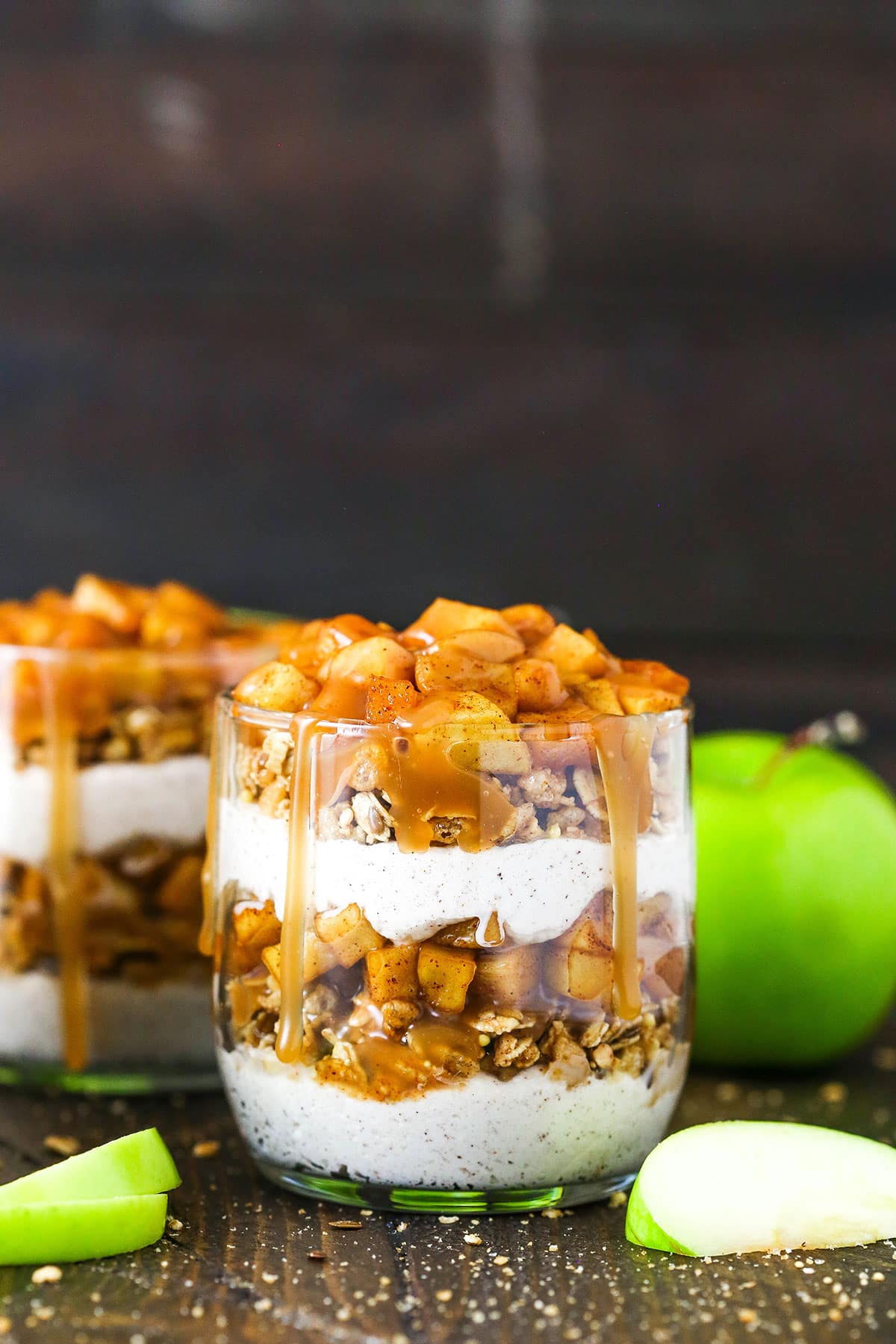 side close up of trifle with some sliced apples around it