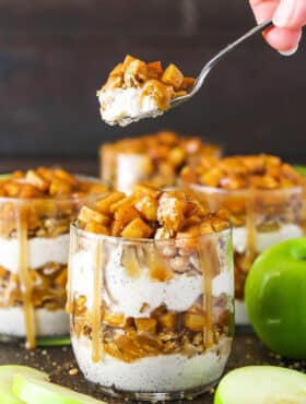 Side image of a Caramel Apple Trifle with a spoon lifting a spoonful out