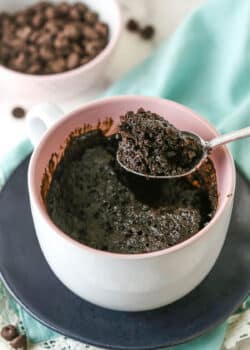 Overhead view of a Chocolate Mug Cake with a bite being removed with a spoon.
