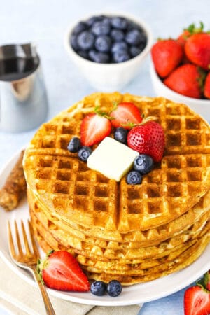 overhead of waffles on white plate without syrup