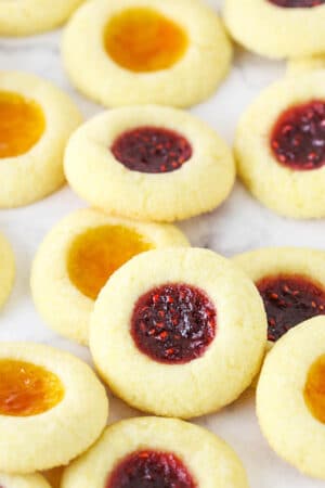 Thumbprint Cookies Filled with Apricot and Raspberry Jam
