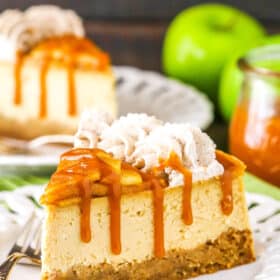 Side view of a slice of Salted Caramel Apple Cheesecake on a plate.