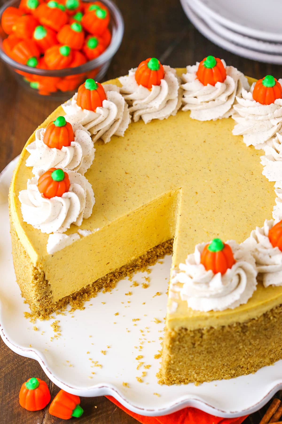 A Pumpkin Cheesecake With A Slice Removed